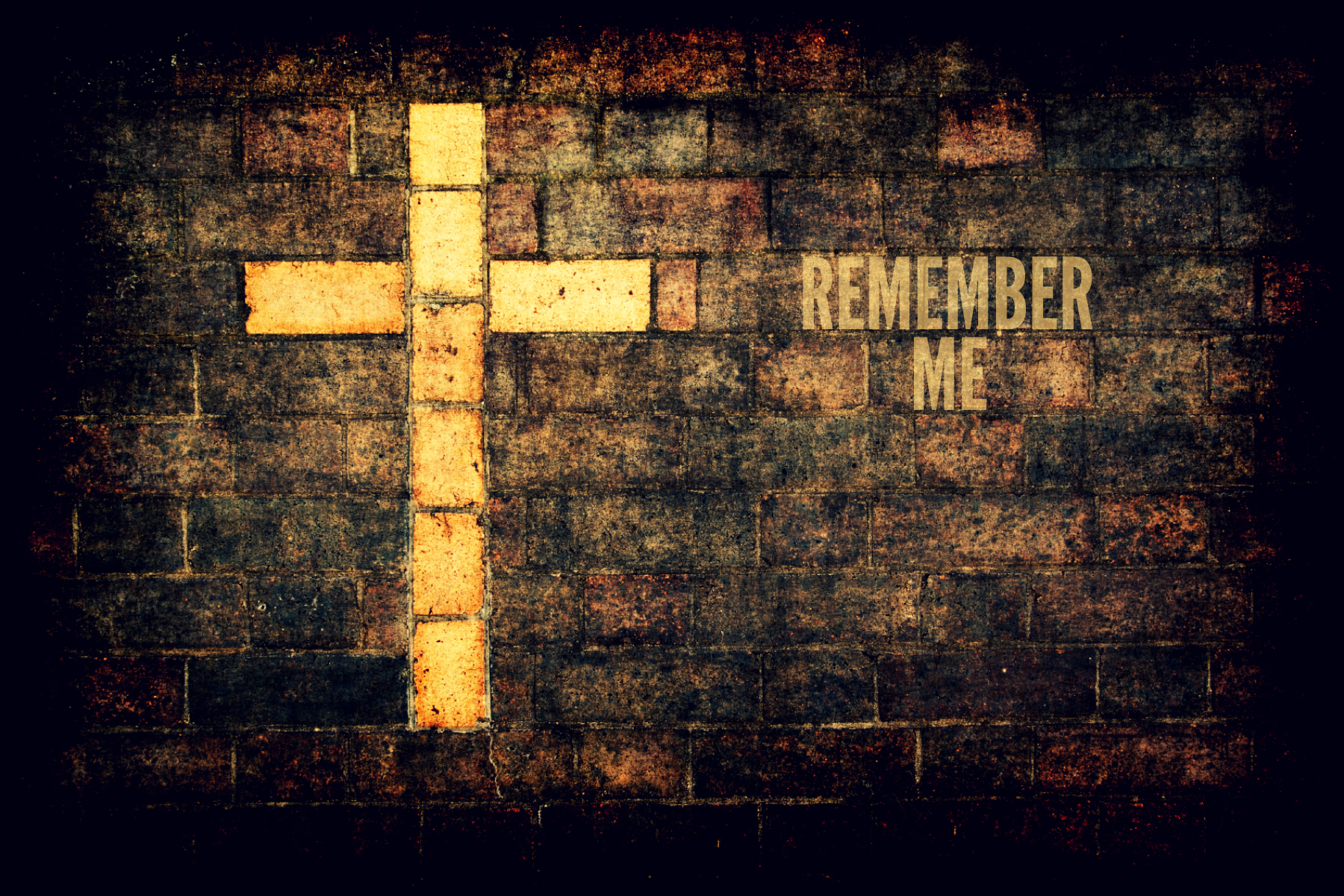 grungy cross of christ built into a brick wall as background